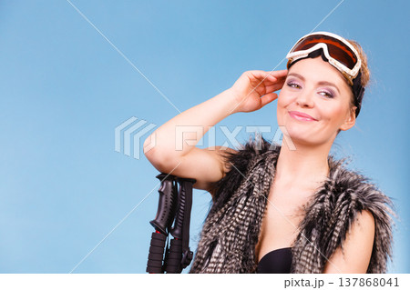 Sexy woman holding ski poles 137868041