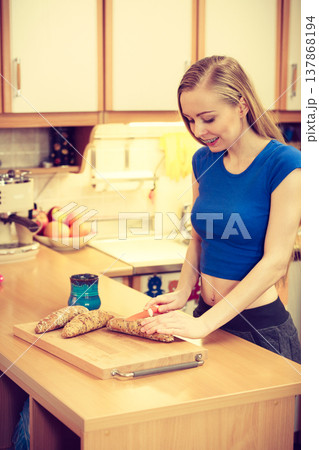 Woman preparing healthy breakfast making sandwich 137868194