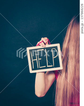 Suicidal woman holding help sign 137868226