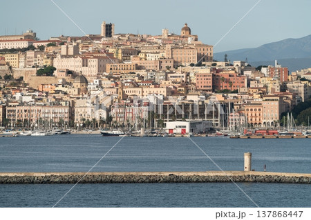 Cagliari skyline and Castello district across harbor in Sardinia Italy 137868447