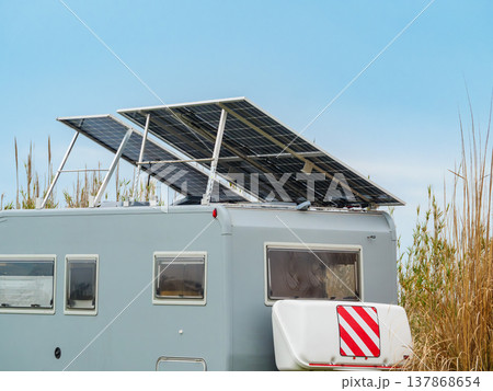 Caravan with tilt solar panels on roof. Caravan with tilt solar panels on roof. 137868654