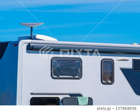 Awning on side of caravan and Starlink terminal on roof Awning on side of caravan and Starlink terminal on roof 137868656