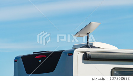 Awning on side of caravan and Starlink terminal on roof Awning on side of caravan and Starlink terminal on roof 137868658