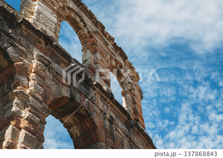 Amazing view of Verona Arena in a blue sky. A Roman amphitheatre in Piazza Bra, Verona, Italy. Amazing view of Verona Arena in a blue sky. A Roman amphitheatre in Piazza Bra, Verona, Italy. 137868843