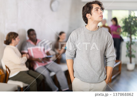 Young guy standing in reception area 137868862