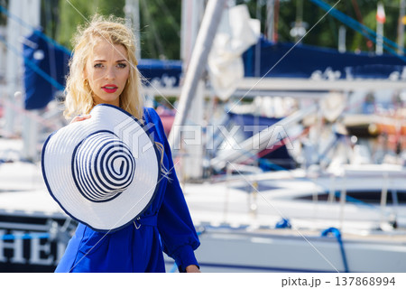 Fashion model wearing blue jumpsuit 137868994