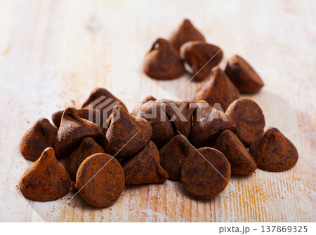 Chocolate truffle candies on wooden table 137869325