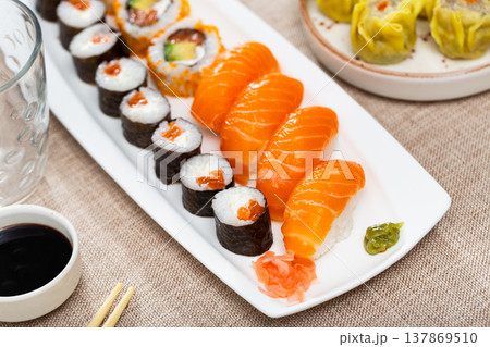 Set of different sushi maki, uramaki and nigiri on plate Set of different sushi maki, uramaki and nigiri on plate 137869510