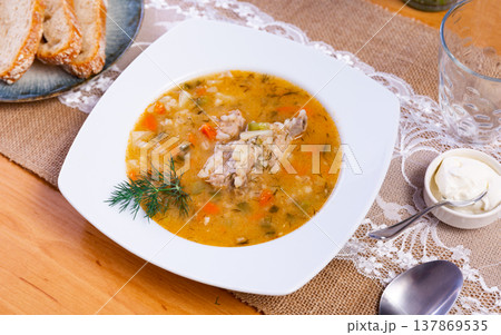 National Russian dish is Pickle soup with meat, cooked on basis of pickled cucumbers and pearl barley National Russian dish is Pickle soup with meat, cooked on basis of pickled cucumbers and pearl barley 137869535