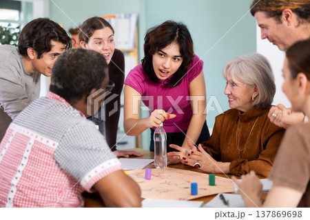 Group of people playing board game Group of people playing board game 137869698