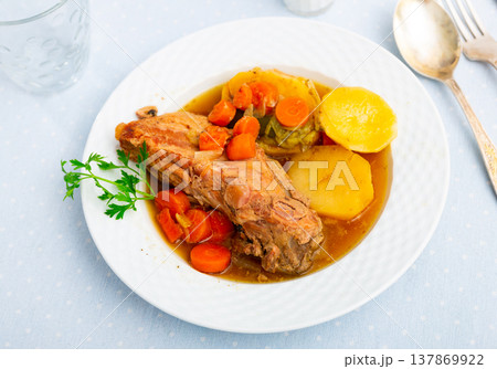 Ribs with vegetables prepared and served on plate Ribs with vegetables prepared and served on plate 137869922