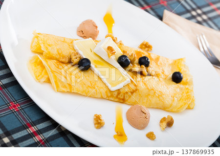 Pancakes with brie cheese a 137869935