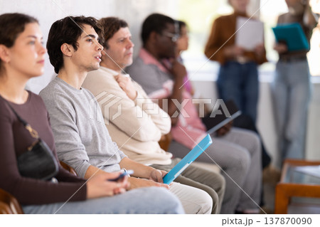 People are sitting in line and waiting for an interview 137870090