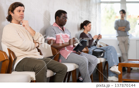 People are sitting in line and waiting for an interview 137870144