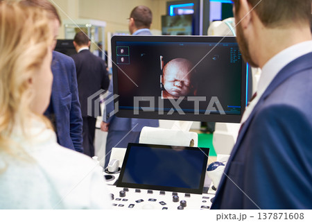 Visitors and ultrasound equipment Visitors and ultrasound equipment 137871608