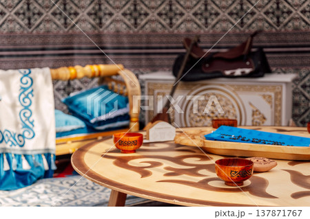 Rustic Table Scene. Intimate Setting Featuring Carved Bowls And Spirited Social Interaction Rustic Table Scene. Intimate Setting Featuring Carved Bowls And Spirited Social Interaction 137871767