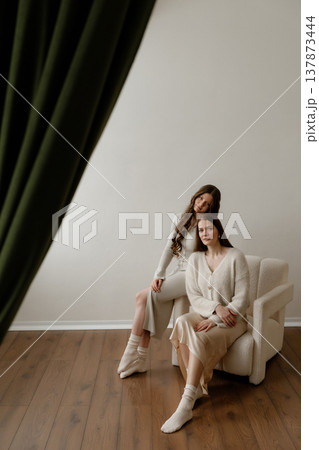 Family Portrait Shot. Warm Family Moment Captured With Tender Embraces And Soft Lighting 137873444