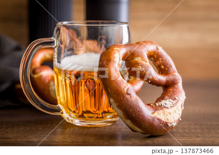 Beer Mug and Soft Pretzels on Rustic Wooden Table. Oktoberfest Snack and Bavarian Pub Food 137873466