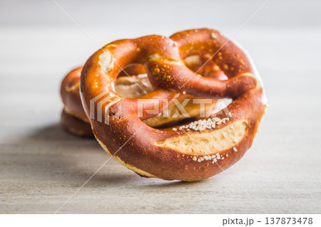 Soft Salted Pretzels Fresh From The Bakery On A Light Rustic Table 137873478