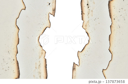 Layers of white sheets with burnt edges 137873658