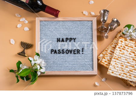 Jewish holiday Passover. Bottle of wine, spring flowers and matzo bread Jewish holiday Passover. Bottle of wine, spring flowers and matzo bread 137873796