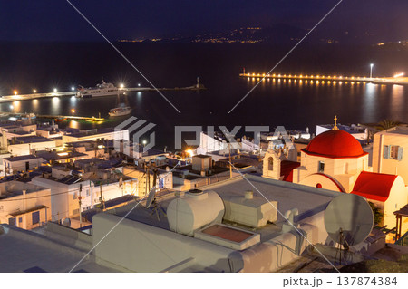 Mykonos harbor at night with red dome chapel Greece Mykonos harbor at night with red dome chapel Greece 137874384