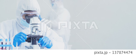 Banner Scientist man look Microscope research in science laboratory. Banner Asian scientist use microbiology microscope in laboratory equipment chemistry lab. Biochemistry experiment with copy space 137874474