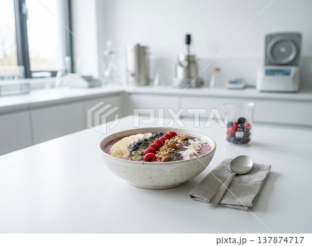 Healthy acai bowl with berries and granola in kitchen with food photography 137874717