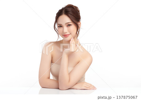 A beautiful young Asian woman with clean, fresh skin against a white background. Skincare, facial treatment, cosmetology, beauty, and spa. An elegant portrait of an Asian woman. A beautiful young Asian woman with clean, fresh skin against a white background. Skincare, facial treatment, cosmetology, beauty, and spa. An elegant portrait of an Asian woman. 137875067