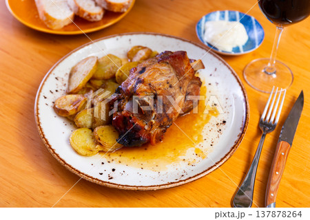 Appetizing pork knuckle served on platter Appetizing pork knuckle served on platter 137878264