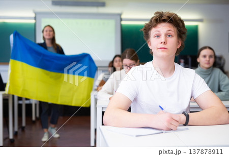 Young boy student studying diligently at school 137878911
