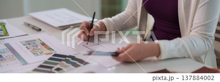 Asian Adult Woman Architect Designer Sketching Architectural Blueprints Creating Floor Plans Interior Designs Professional Project Development Work Office Workspace Asian Adult Woman Architect Designer Sketching Architectural Blueprints Creating Floor Plans Interior Designs Professional Project Development Work Office Workspace 137884002