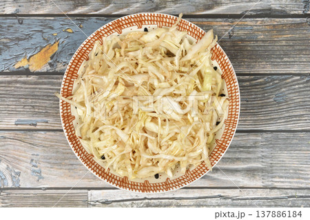 Shredded Cabbage Salad in a Ceramic Bowl 137886184