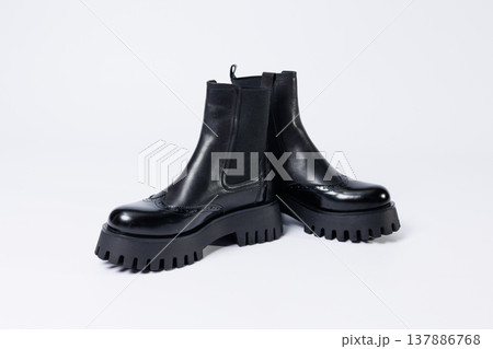 Women's black boots with genuine leather on a rough sole without laces. New collection of women's spring shoes Women's black boots with genuine leather on a rough sole without laces. New collection of women's spring shoes 137886768