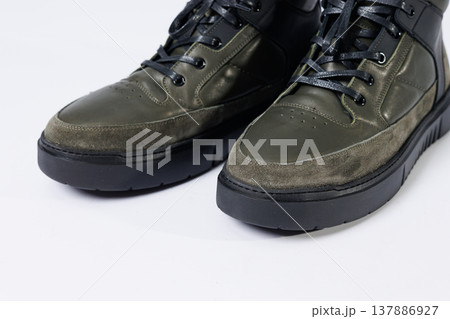 Leather short men's boots on a white background. Winter boots collection 2022. Leather short men's boots on a white background. Winter boots collection 2022. 137886927