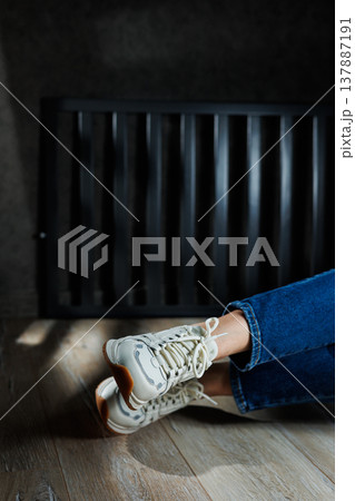 Collection of women's leather shoes. Female legs in leather white casual sneakers. Stylish women's sneakers 137887191