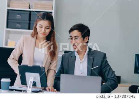 Group of business people and software developers working as a team in office Group of business people and software developers working as a team in office 137887348