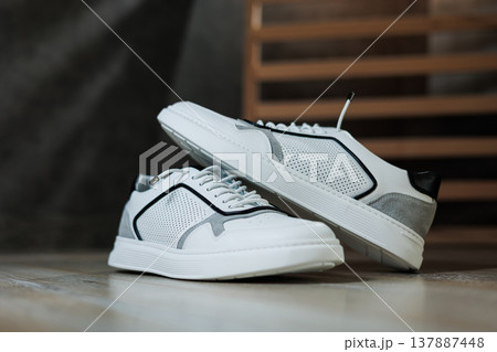 Men's white leather sneakers for every day. Collection of summer men's shoes. Stylish men's shoes for the summer 137887448