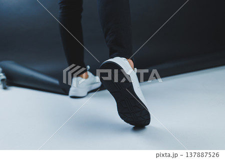 Men's casual white shoes made of genuine leather, men on shoes in white sneakers. High quality photo 137887526