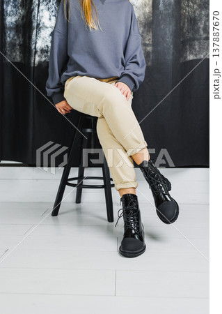 Fashionable women's stylish leather boots. Black women's boots made of genuine leather. New collection of winter shoes for stylish girls. Fashionable women's stylish leather boots. Black women's boots made of genuine leather. New collection of winter shoes for stylish girls. 137887670