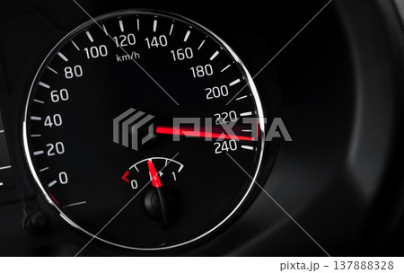 Close-up of a car speedometer displaying high speed Close-up of a car speedometer displaying high speed 137888328