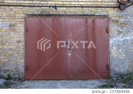 old metal door to the car garage 137889486