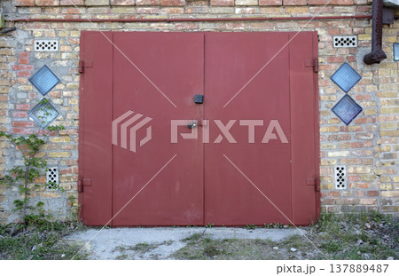old metal door to the car garage 137889487