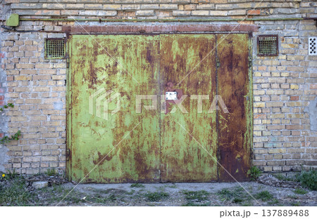 old metal door to the car garage 137889488