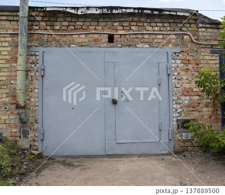 old metal door to the car garage 137889500