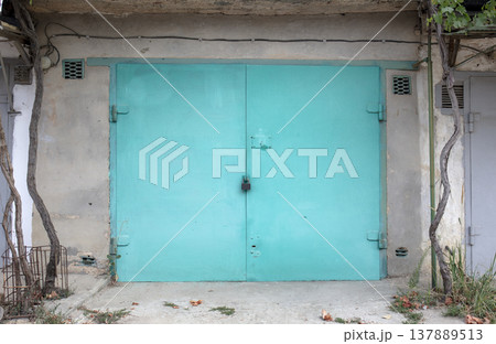 old metal door to the car garage 137889513