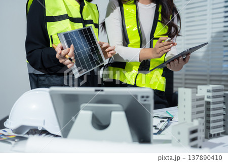 Confident team of architect working together in a office. 137890410