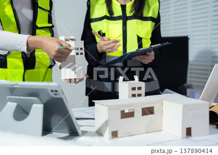 Business woman hand working and laptop with on on architectural project. 137890414