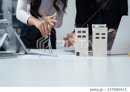 Business woman hand working and laptop with on on architectural project. 137890415