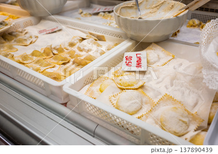 Genoa, liguria, italy. May 18, 2024. Freshly made ravioli with lemon filling and traditional pasta are displayed in trays at mercato orientale in genoa, italy Genoa, liguria, italy. May 18, 2024. Freshly made ravioli with lemon filling and traditional pasta are displayed in trays at mercato orientale in genoa, italy 137890439